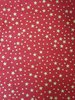 X'mas fabric. Golden star in red background. 140cm wide.